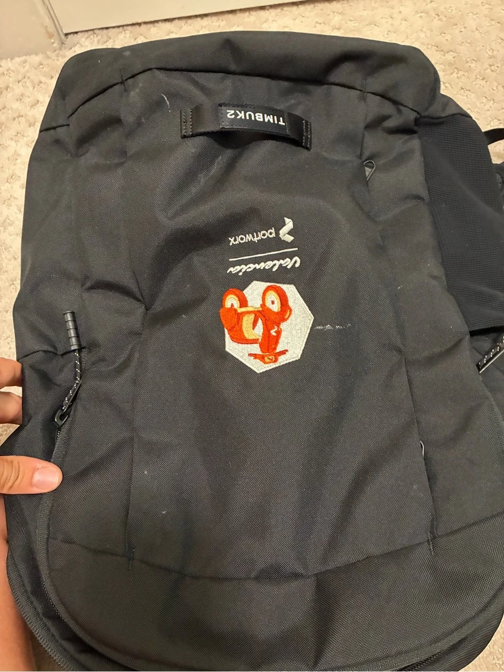 Timbuk2 Black Backpack with Orange Valencia Graphic